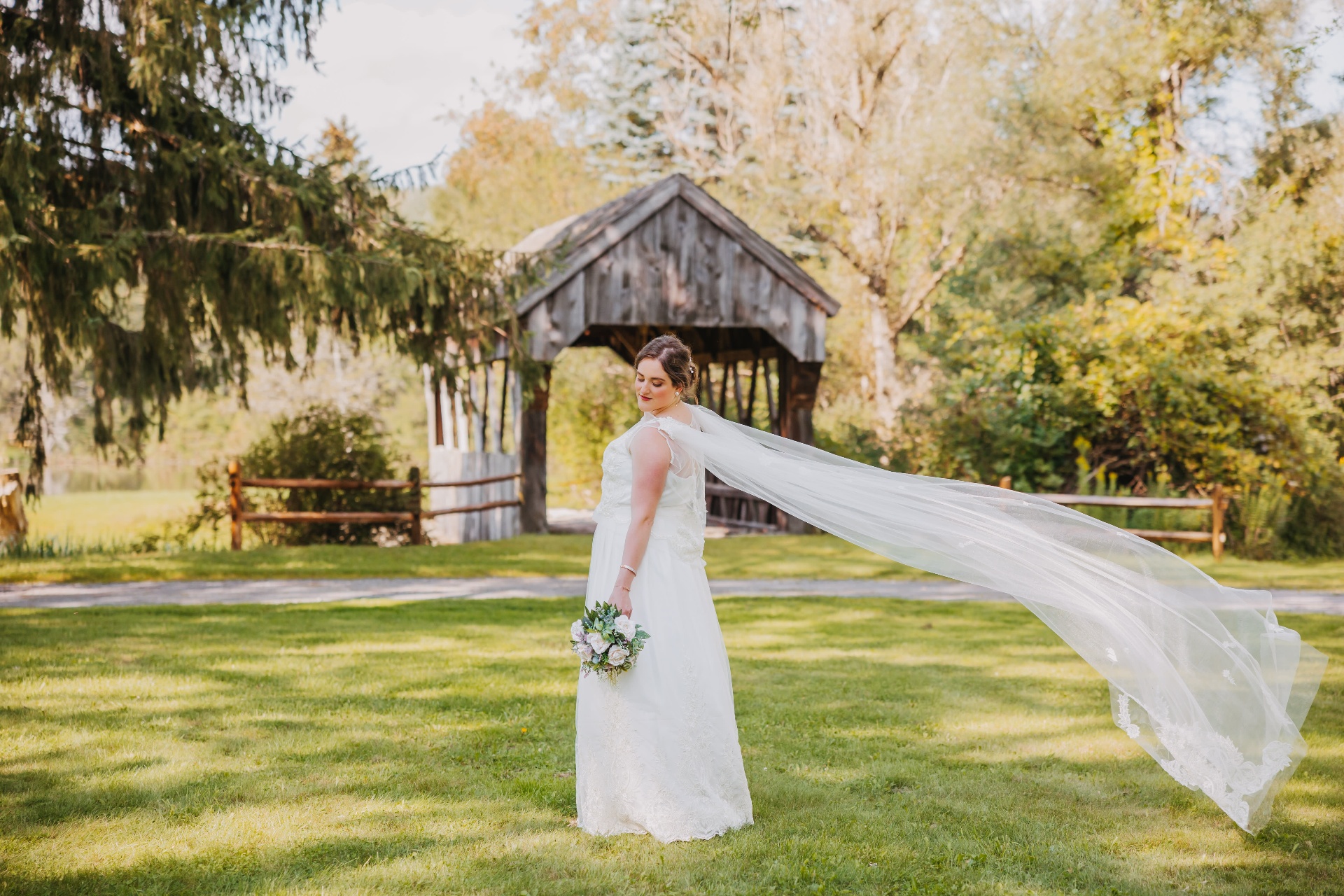 Outdoor wedding ceremony at the covered bridge and gazebo of Americana Village