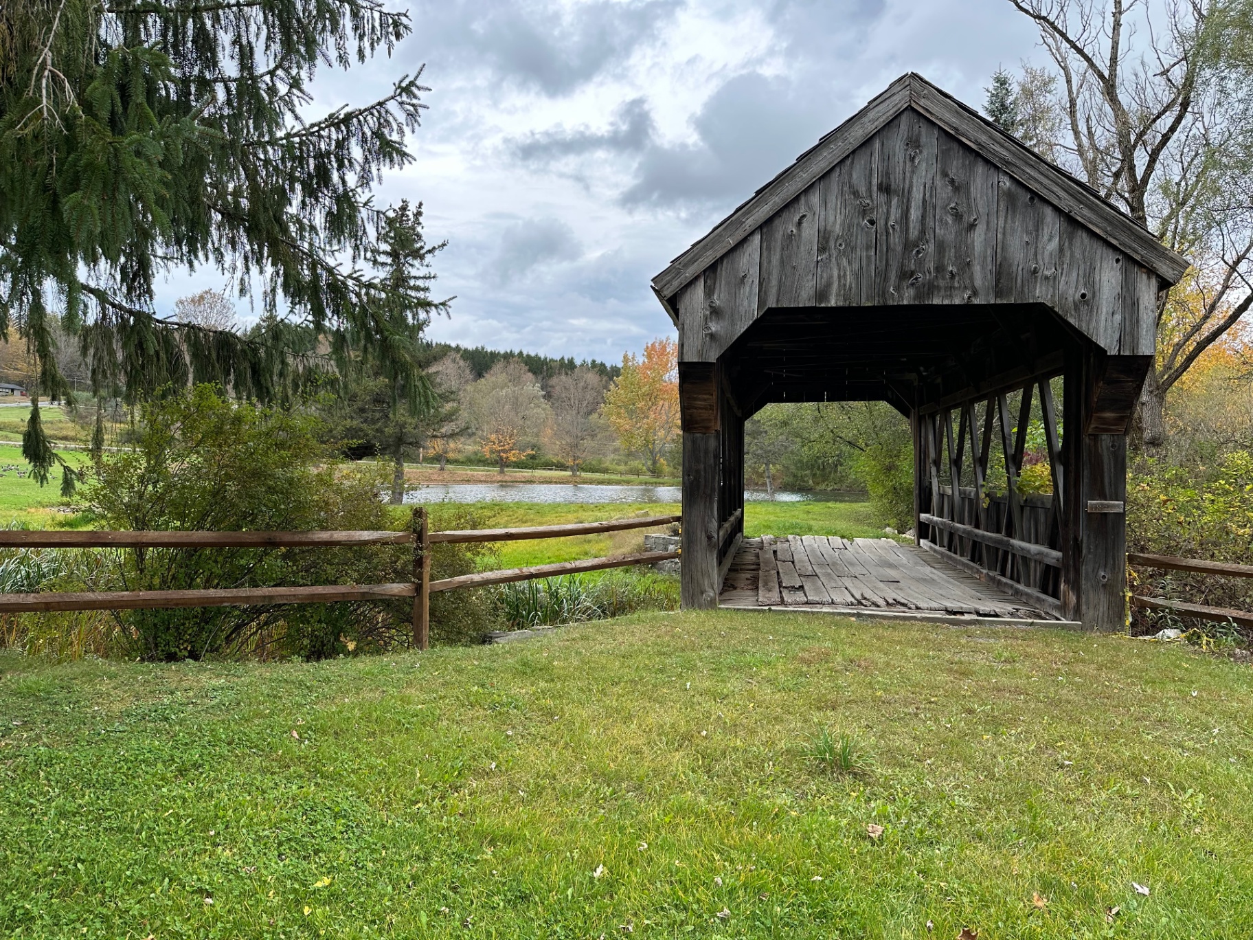 The pond and covered bridge at Americana Village