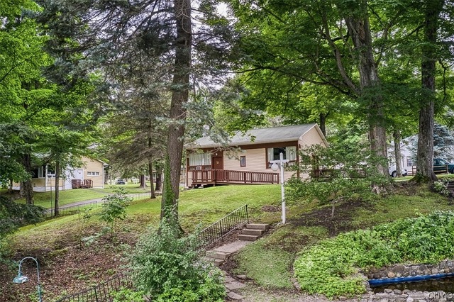 A woodland cabin exterior at The Grove