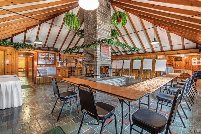 U-shape conference layout beneath The Tepee's peaked pine ceiling